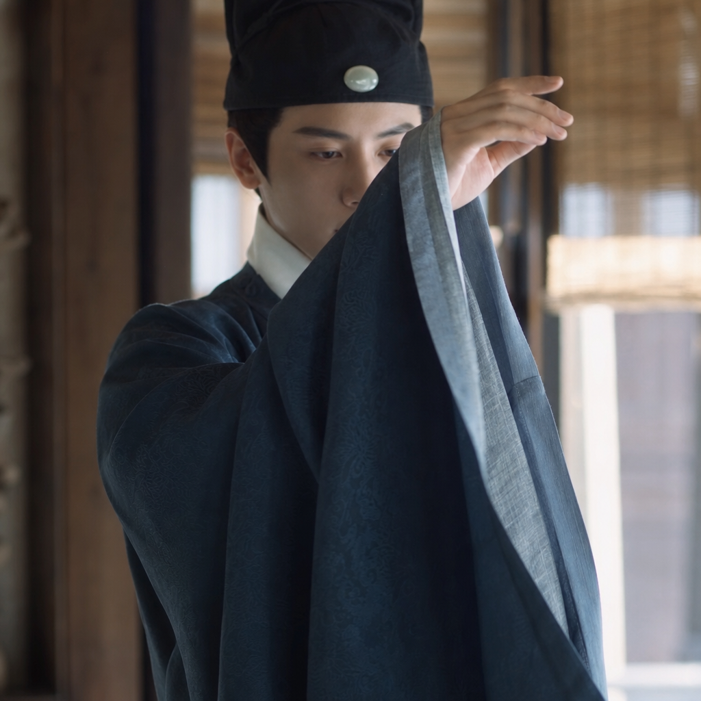 Ming dynasty sleeve drape fabric texture and arm movement detail